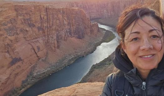 Student by canyon with river